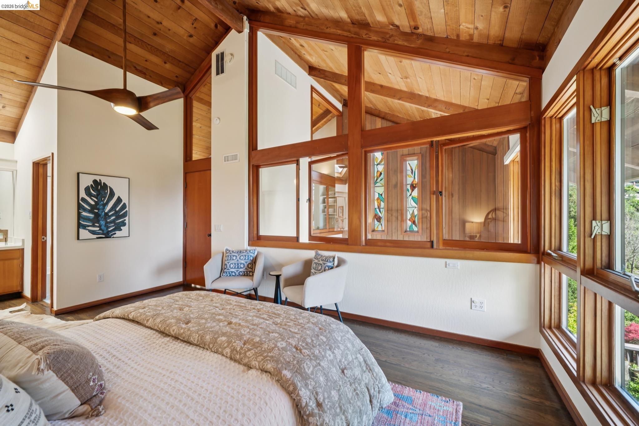 1183 Keeler Avenue Berkeley, CA 94708 - Photo 34 of 53 Bedroom featuring dark wood finished floors, a high wood beamed ceiling, and ensuite bath