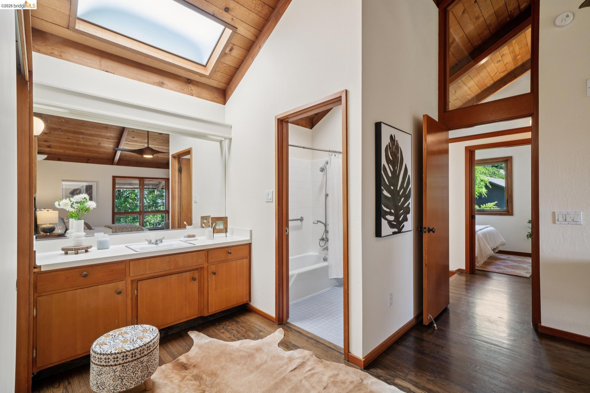 1183 Keeler Avenue Berkeley, CA 94708 - Photo 37 of 53 Full bathroom with wood ceiling, ensuite bathroom, lofted ceiling with beams, dark wood finished floors, and vanity