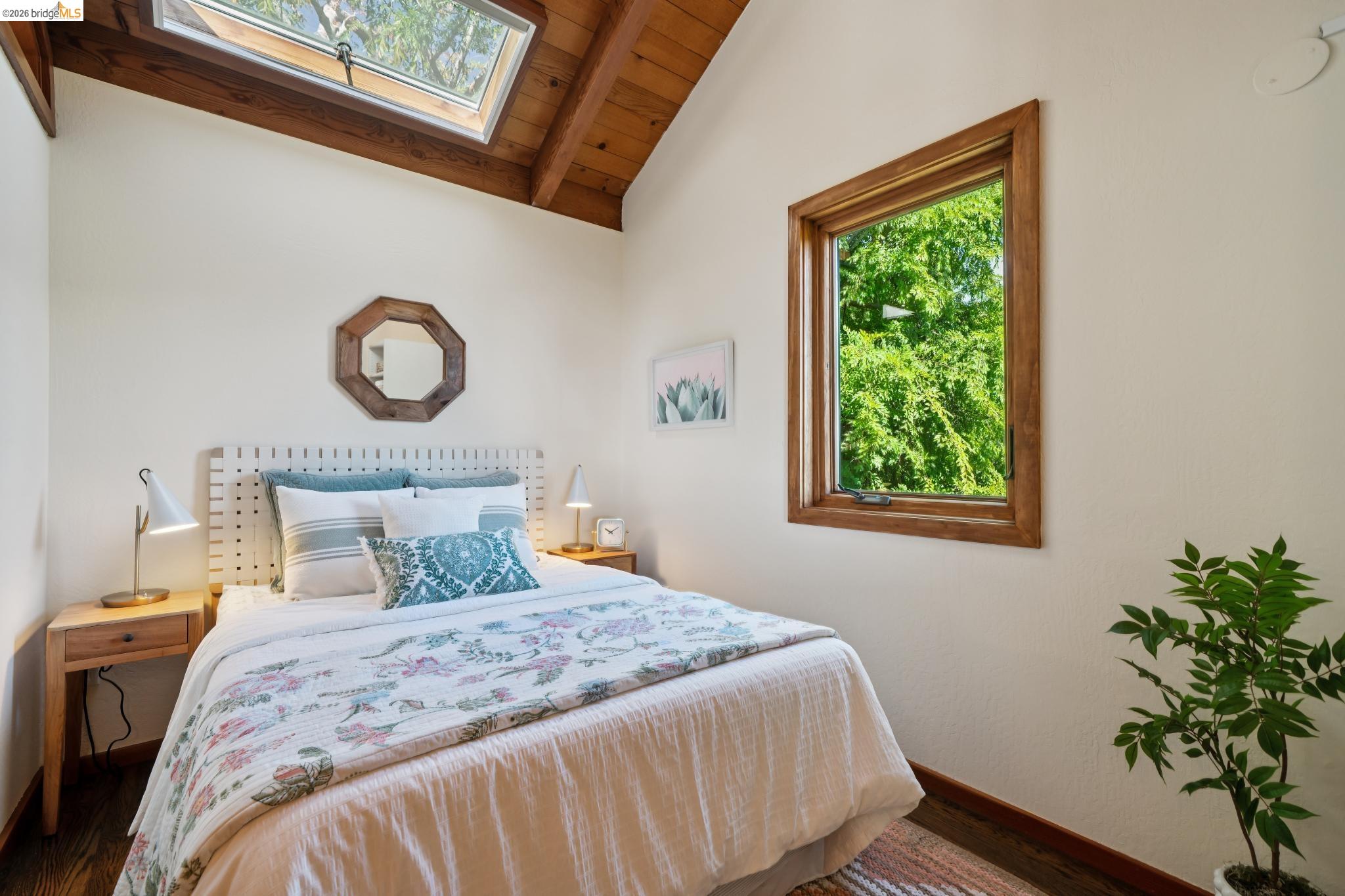 1183 Keeler Avenue Berkeley, CA 94708 - Photo 39 of 53 Bedroom featuring a skylight, lofted ceiling with beams, wooden ceiling, and wood finished floors