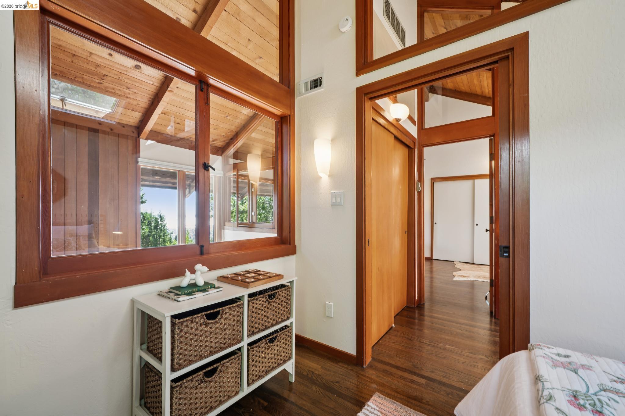 1183 Keeler Avenue Berkeley, CA 94708 - Photo 40 of 53 Bedroom featuring dark wood-style floors, wood ceiling, and lofted ceiling with beams