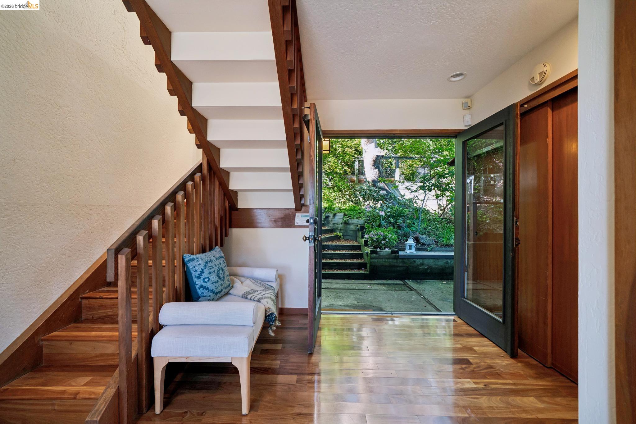 1183 Keeler Avenue Berkeley, CA 94708 - Photo 5 of 53 Foyer entrance with stairs and wood finished floors