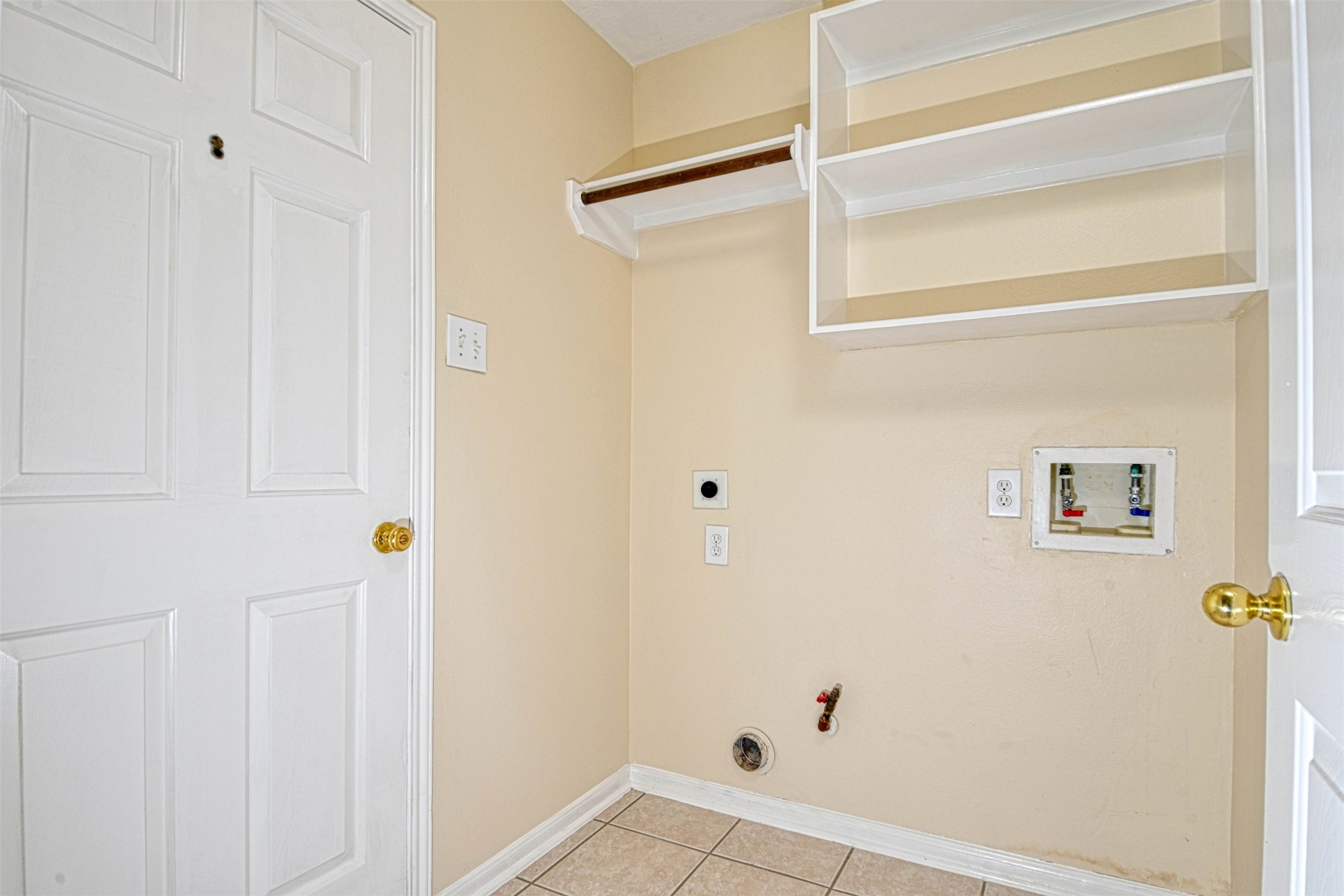 20834 Normandy Forest Drive Spring, TX 77388 - Photo 12 of 12 laundry room with storage space and area to hang clothing to dry.
