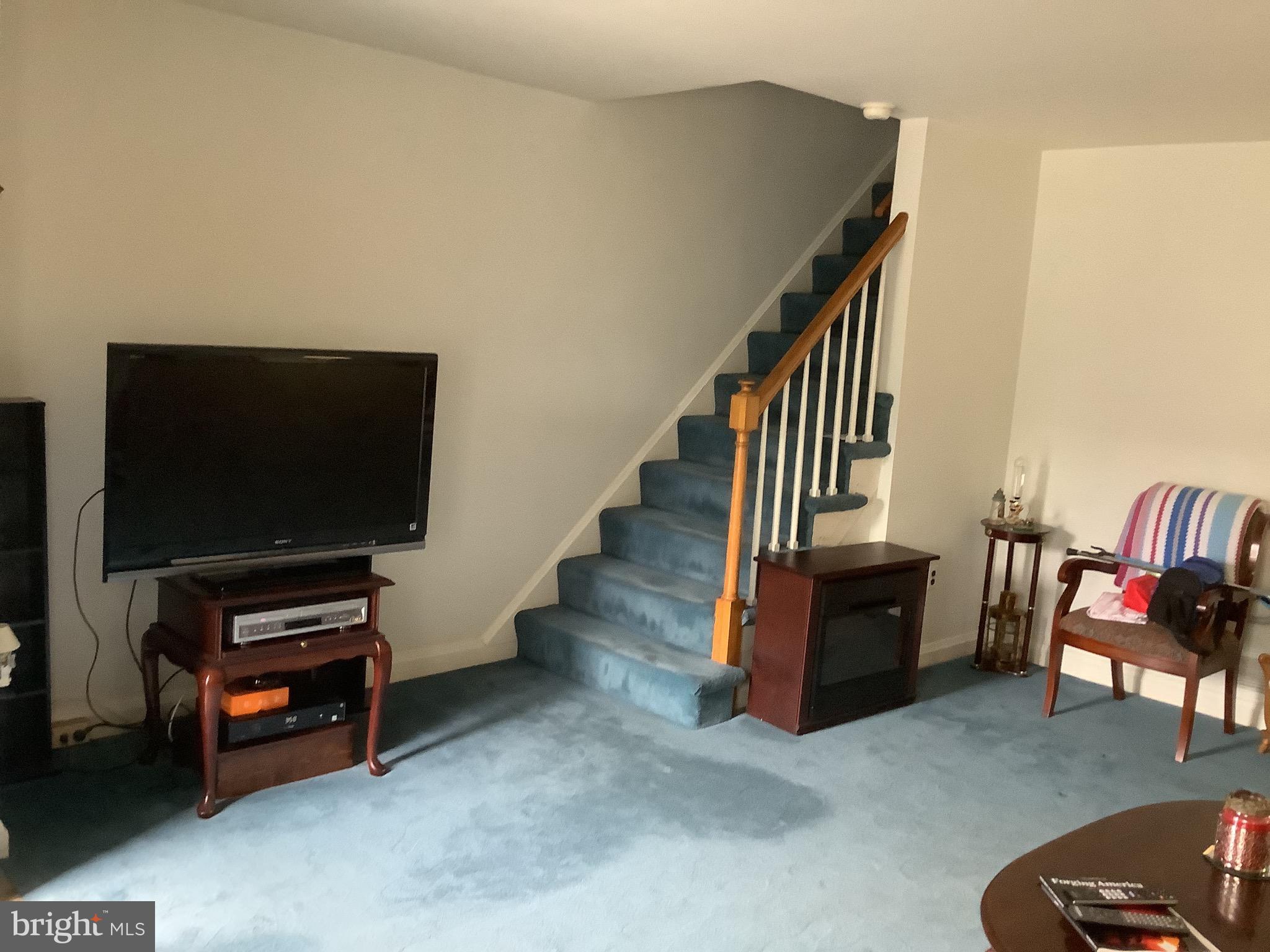 1902 Barry Road Baltimore, MD 21222 - Photo 12 of 34 a living room with furniture and a flat screen tv