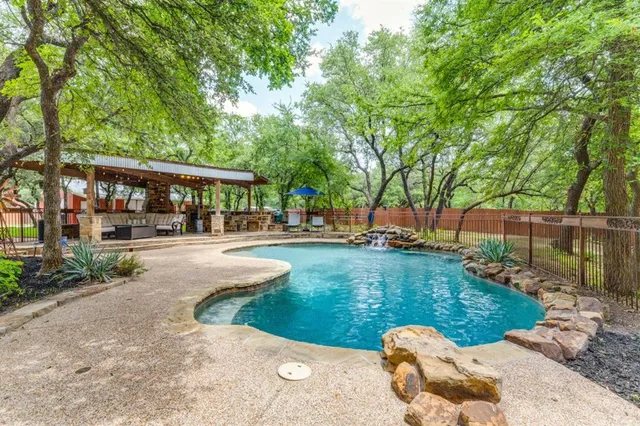 a view of a park with large trees
