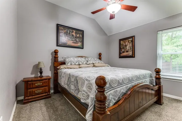 a bedroom with bed and a window