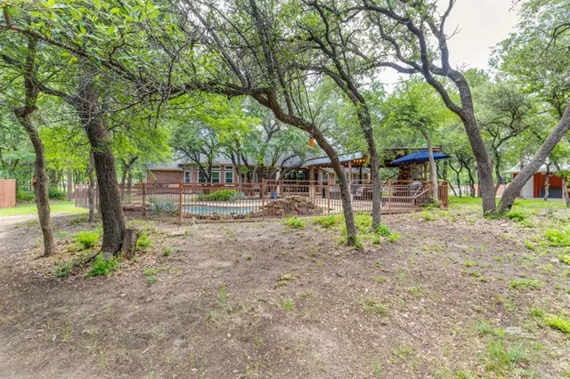 a backyard of a house with lots of green space