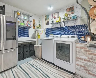 a kitchen with stainless steel appliances granite countertop a stove and a refrigerator