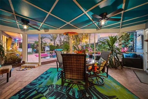 a view of a chairs and tables in the patio