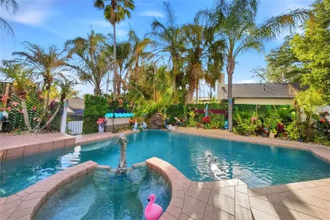 a view of swimming pool with a table and chairs