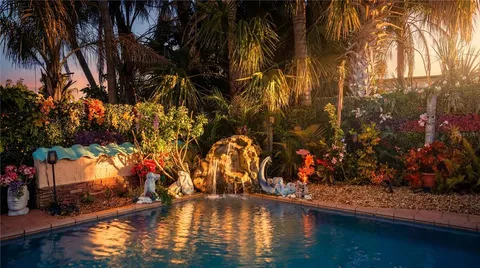 a view of swimming pool with a yard