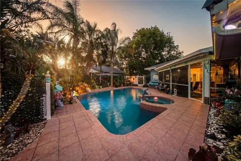 a view of a swimming pool with a patio