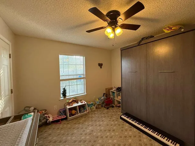 a room with furniture and a window