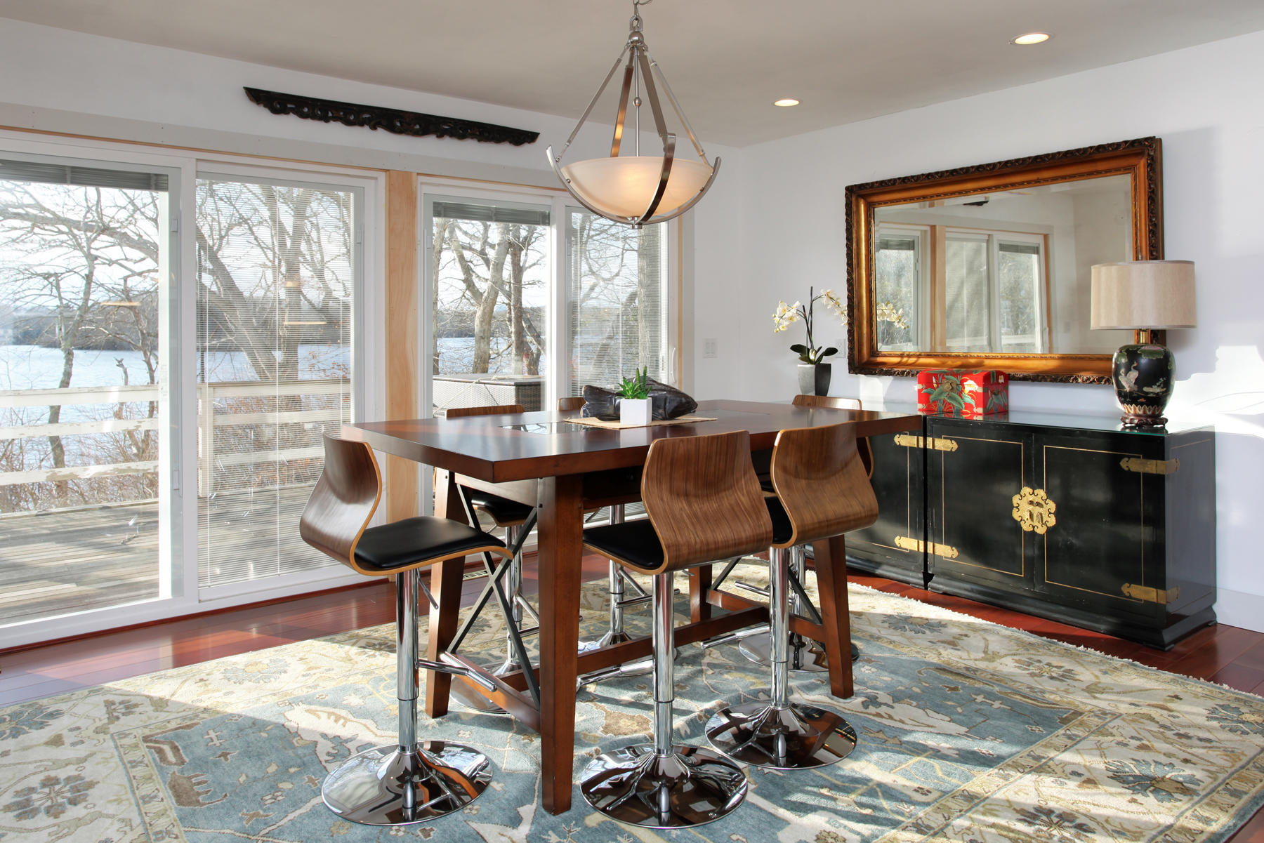 150 Holly Point Road Centerville, MA 02632 - Photo 12 of 28 a view of a dining room with furniture window and wooden floor