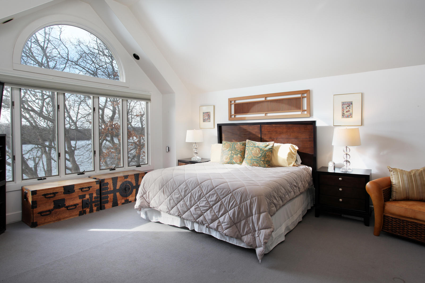 150 Holly Point Road Centerville, MA 02632 - Photo 15 of 28 a bedroom with a bed couch and a large window