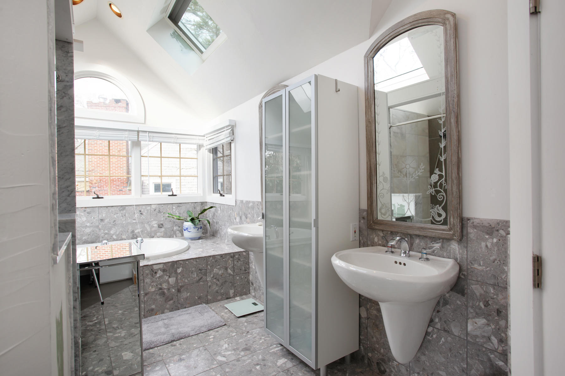 150 Holly Point Road Centerville, MA 02632 - Photo 16 of 28 a bathroom with a sink and a mirror