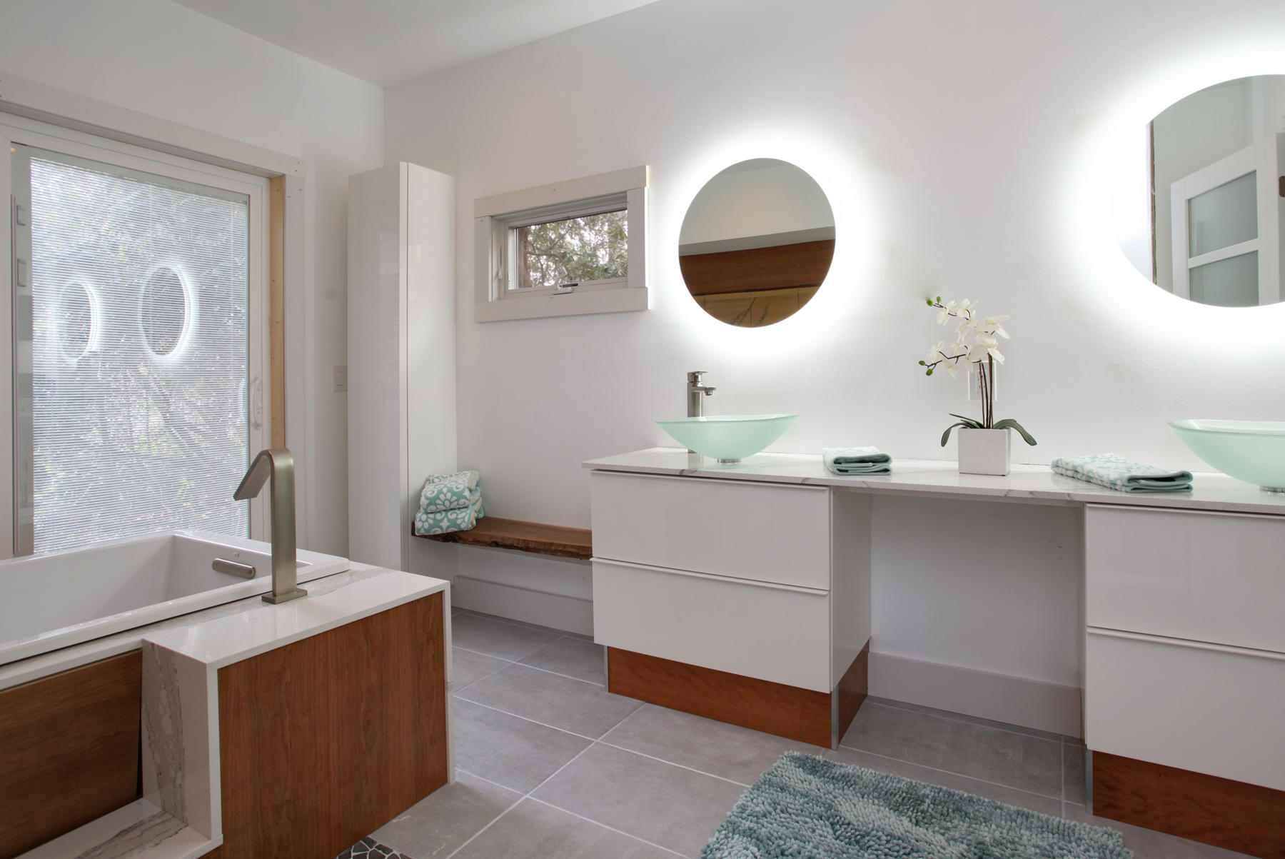 150 Holly Point Road Centerville, MA 02632 - Photo 18 of 28 a en suite bathroom with a double vanity sink and a mirror