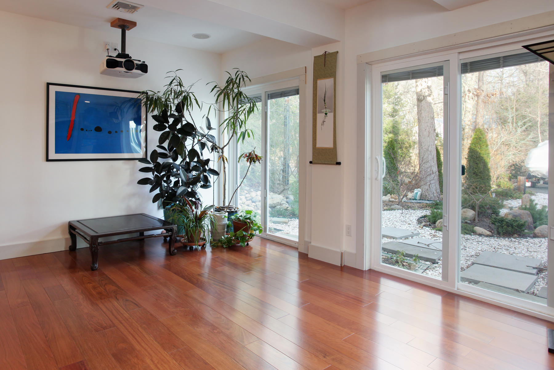 150 Holly Point Road Centerville, MA 02632 - Photo 19 of 28 a living room with furniture and a potted plant