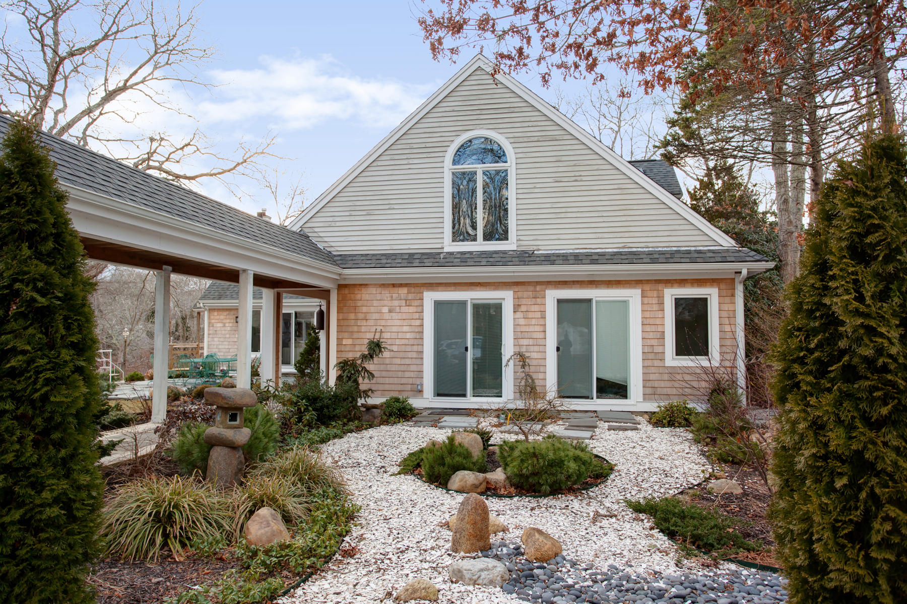 150 Holly Point Road Centerville, MA 02632 - Photo 21 of 28 a front view of a house with garden