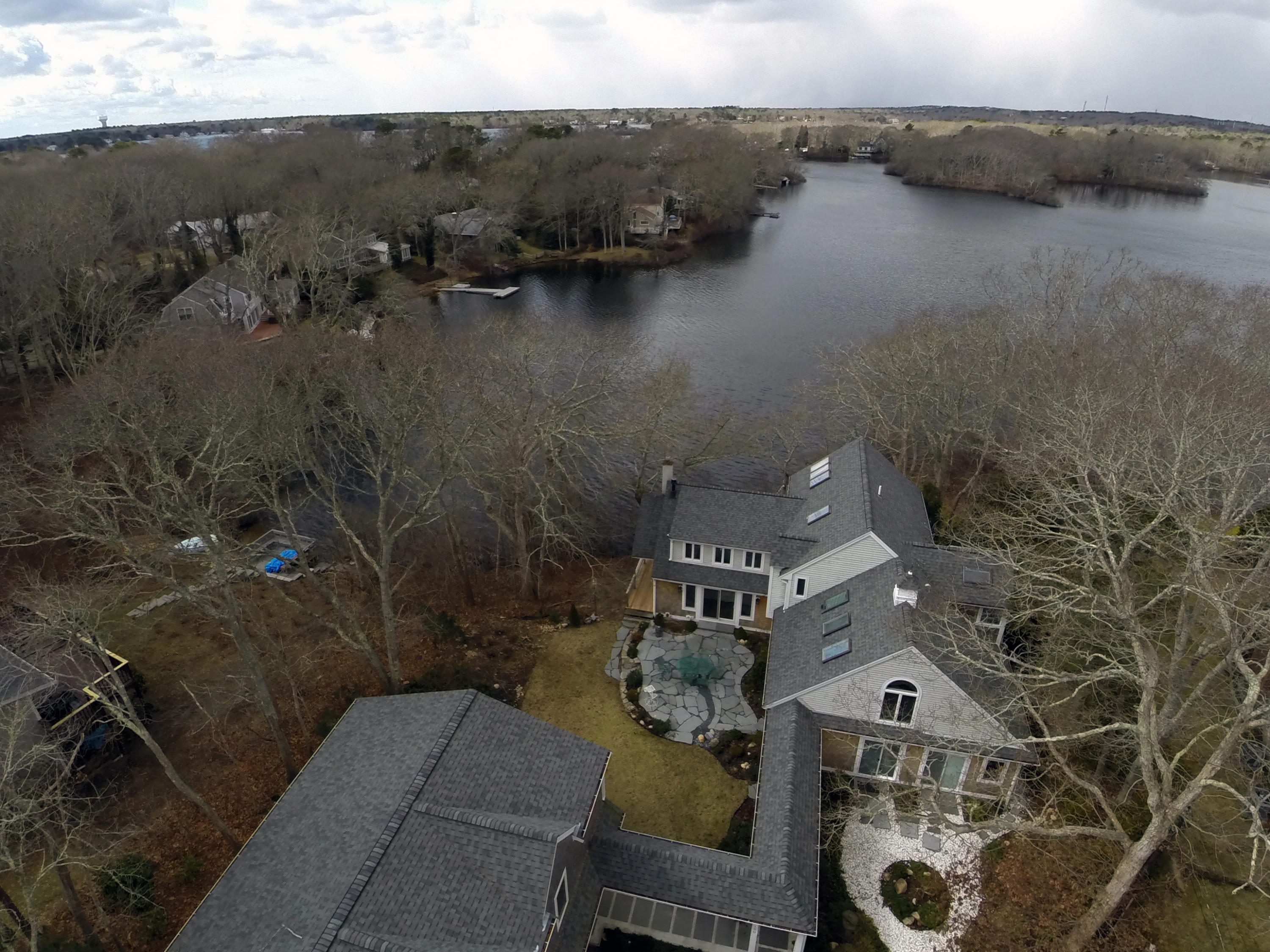 150 Holly Point Road Centerville, MA 02632 - Photo 22 of 28 an aerial view of a house with a lake view