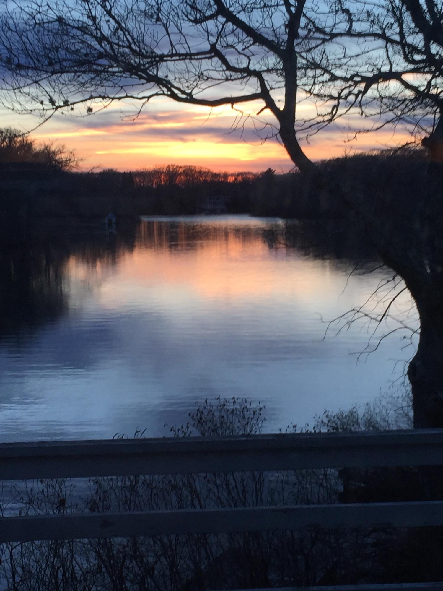 150 Holly Point Road Centerville, MA 02632 - Photo 27 of 28 a view of sunset and lake