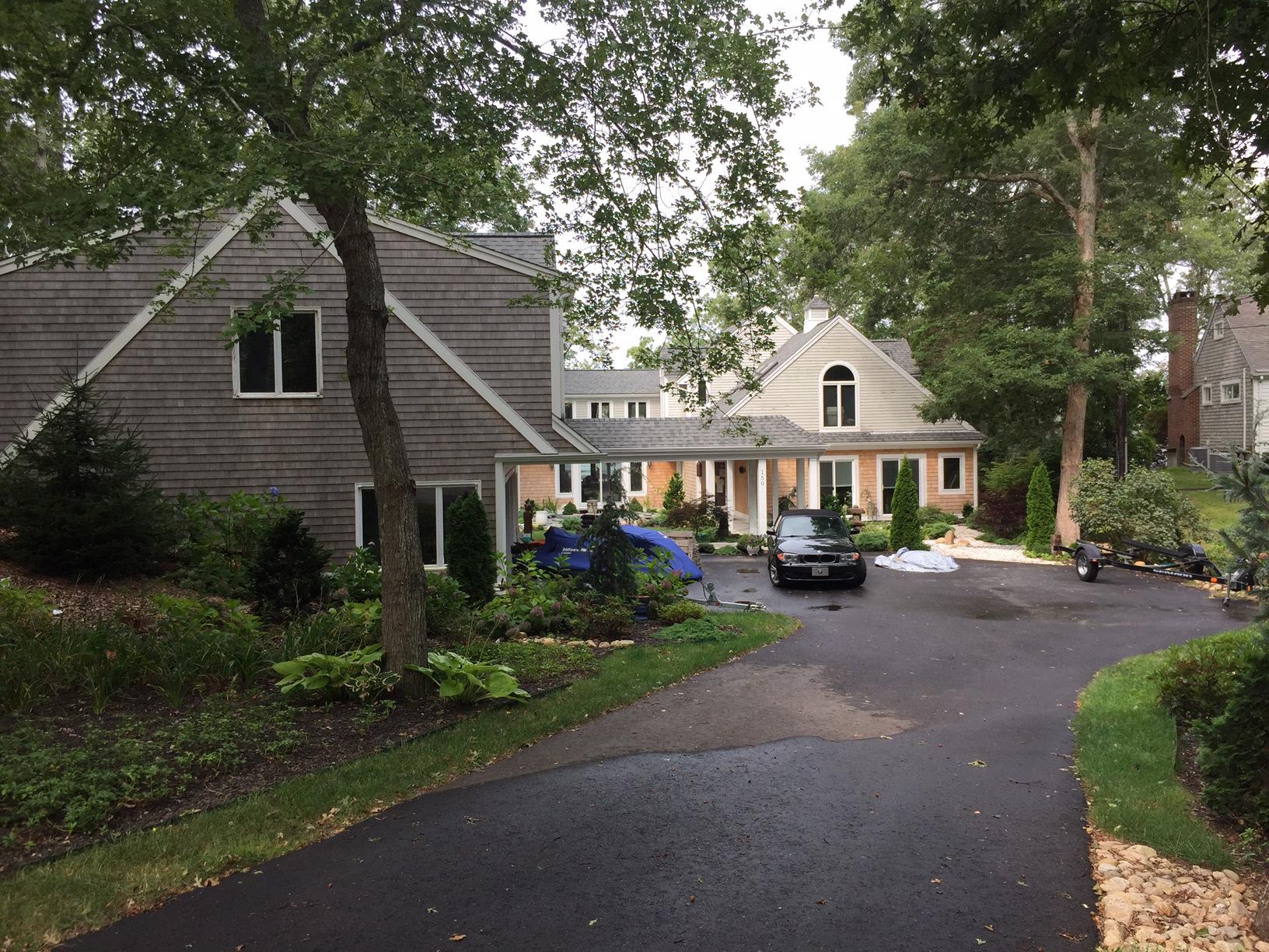150 Holly Point Road Centerville, MA 02632 - Photo 28 of 28 a front view of a house with garden