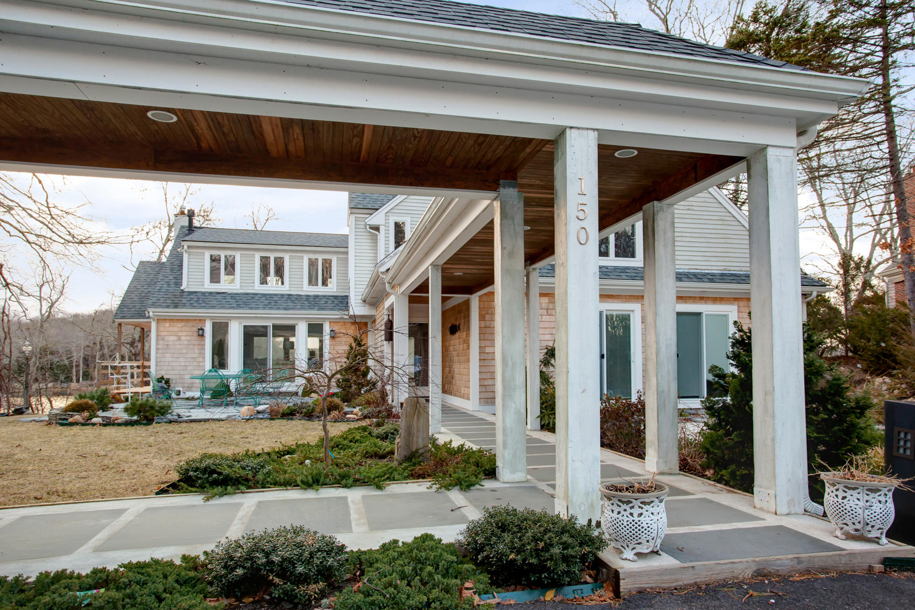 150 Holly Point Road Centerville, MA 02632 - Photo 4 of 28 a view of a building with a street