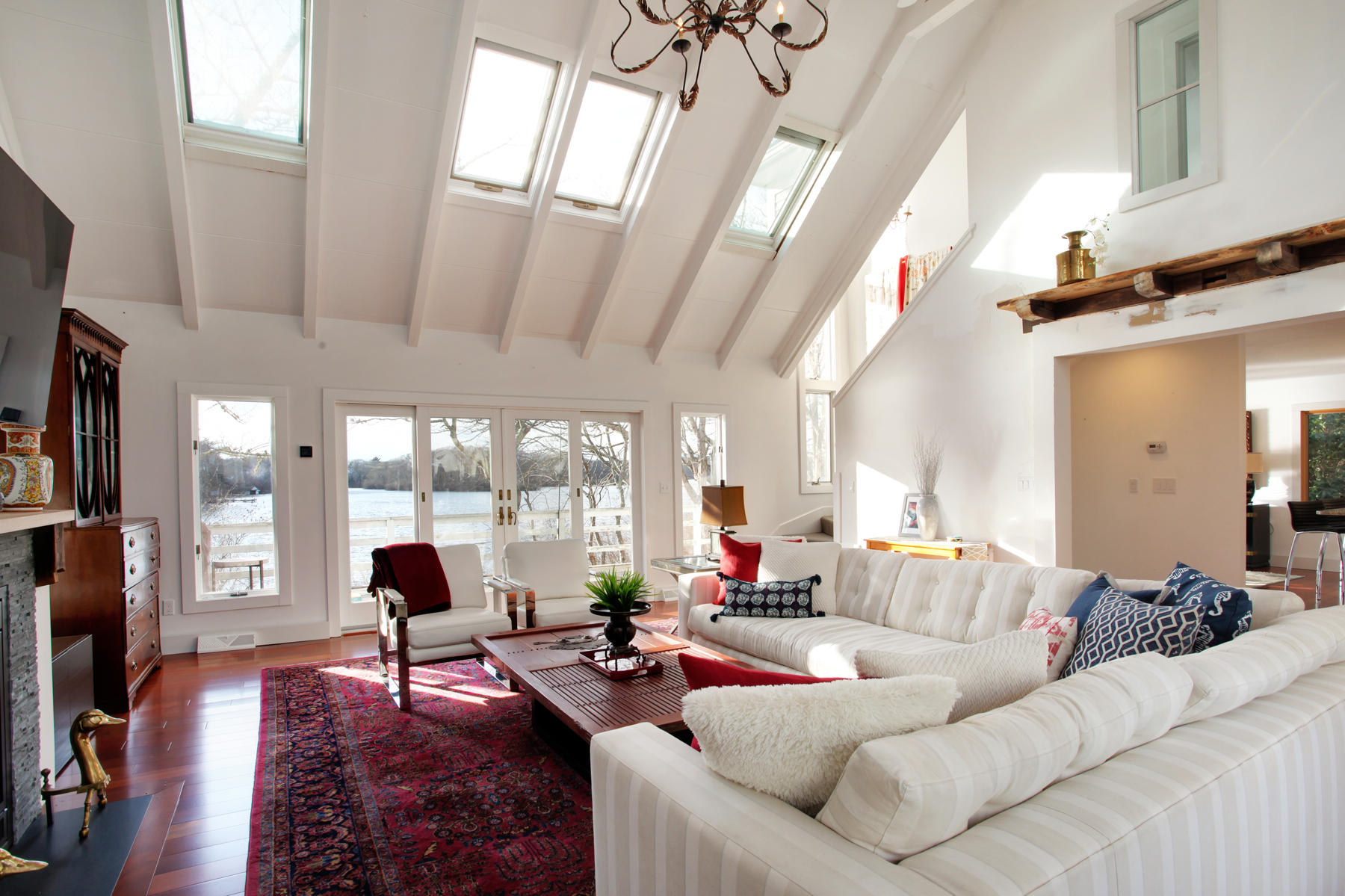 150 Holly Point Road Centerville, MA 02632 - Photo 9 of 28 a living room with furniture or couch and a large window