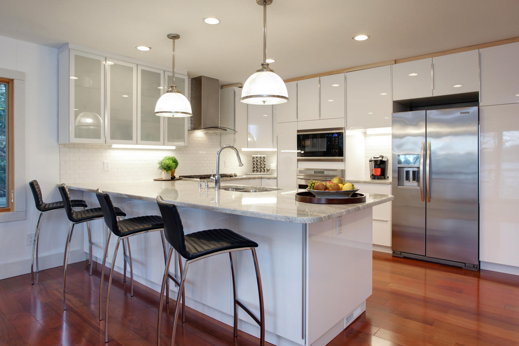 150 Holly Point Road Centerville, MA 02632 - Photo 10 of 28 a kitchen with stainless steel appliances a dining table chairs refrigerator and sink