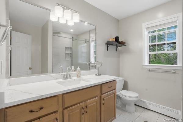 29 Hickory Hill Road Newburgh, NY 12550 - Photo 32 of 47 a bathroom with a sink a toilet and a mirror