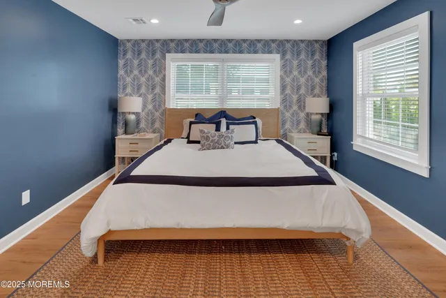 a bed sitting in a room next to a window