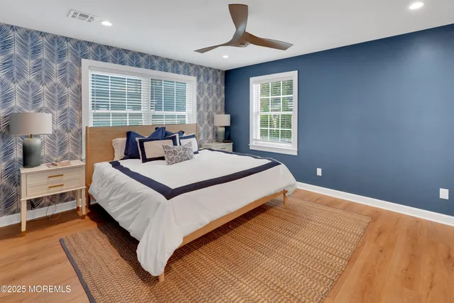 a spacious bedroom with a large bed and a window