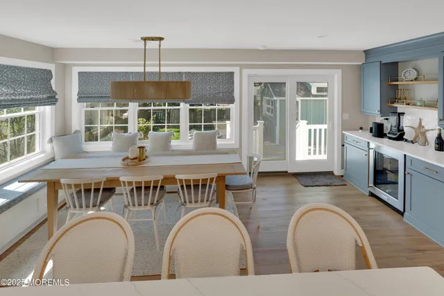 a living room with fireplace furniture and a window
