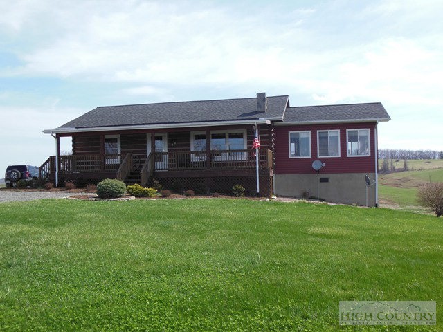 1242 Lazy Branch Road Ennice, NC 28623 - Photo 1 of 29 front view of a house with a yard