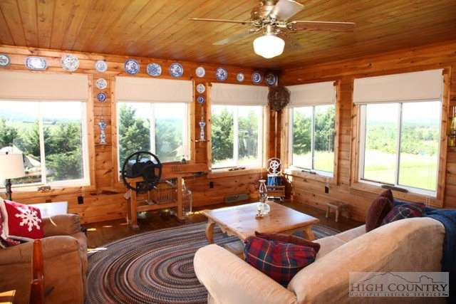 1242 Lazy Branch Road Ennice, NC 28623 - Photo 12 of 29 a living room with furniture and a large window