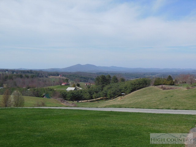 1242 Lazy Branch Road Ennice, NC 28623 - Photo 4 of 29 a view of a grassy field with mountain