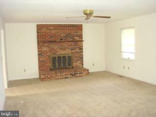 35205 Poplar Neck Road Pittsville, MD 21850 - Photo 6 of 12 an empty room with a fireplace