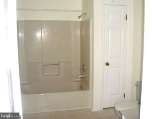35205 Poplar Neck Road Pittsville, MD 21850 - Photo 9 of 12 a bathroom with a bathtub and a shower