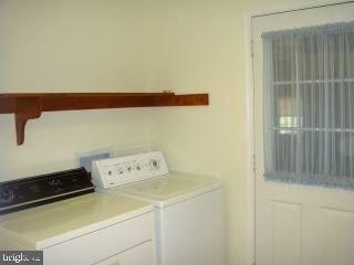 35205 Poplar Neck Road Pittsville, MD 21850 - Photo 10 of 12 a utility room with dryer and washer