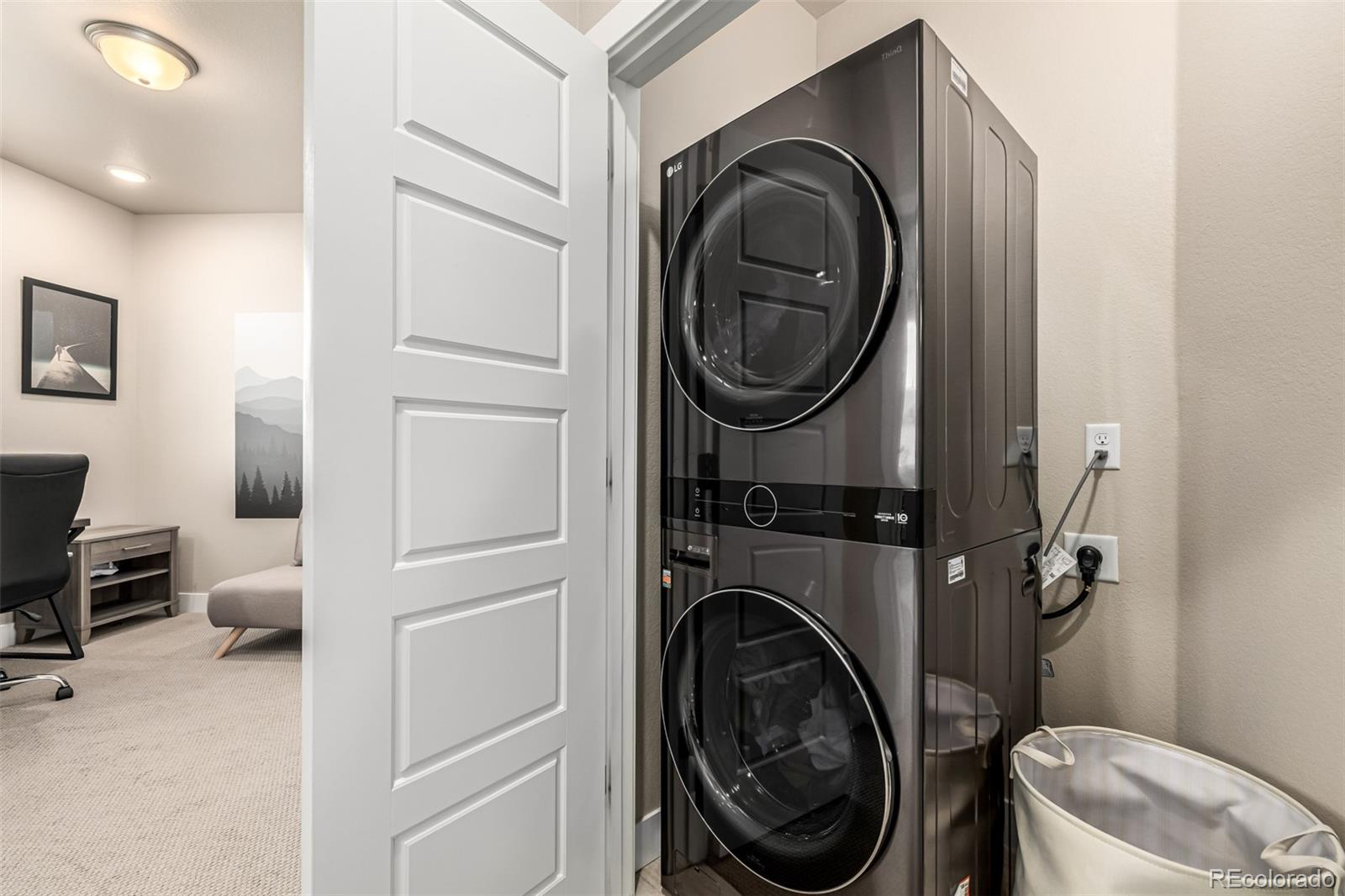 1575 West 68th Avenue Denver, CO 80221 - Photo 27 of 39 a view of a hallway with washer and dryer