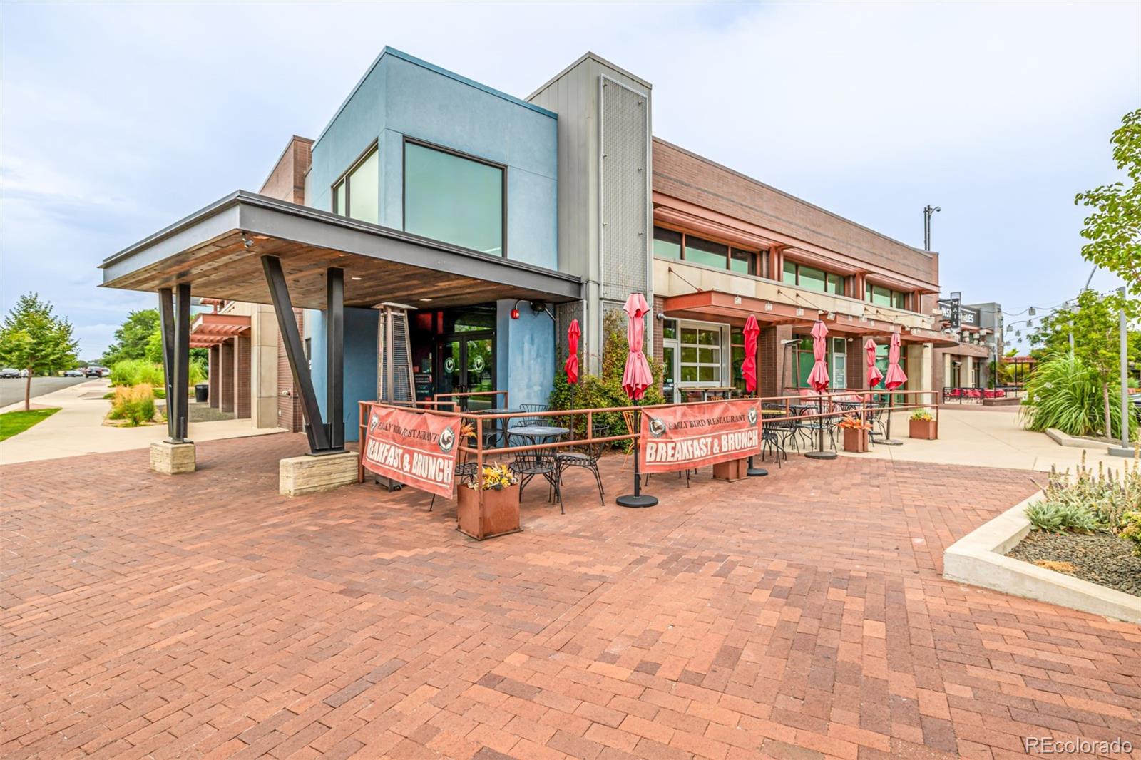 1575 West 68th Avenue Denver, CO 80221 - Photo 33 of 39 a view of a building with sitting area