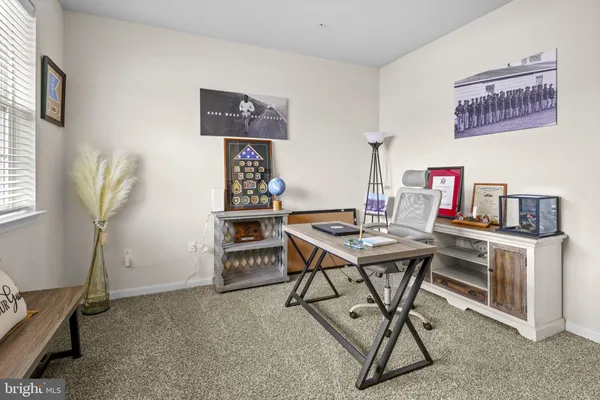 a workspace with furniture and window