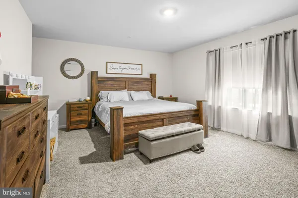a bedroom with a bed and a table in it