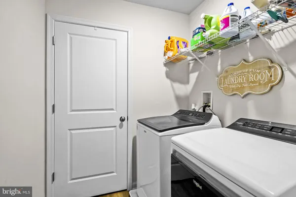 a bedroom with a bed closet and a window