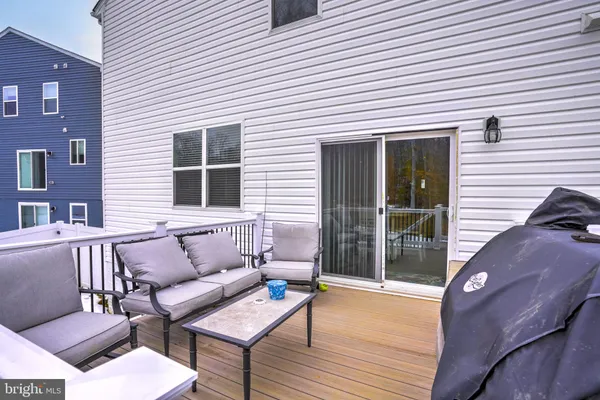 a front view of a house with a chairs