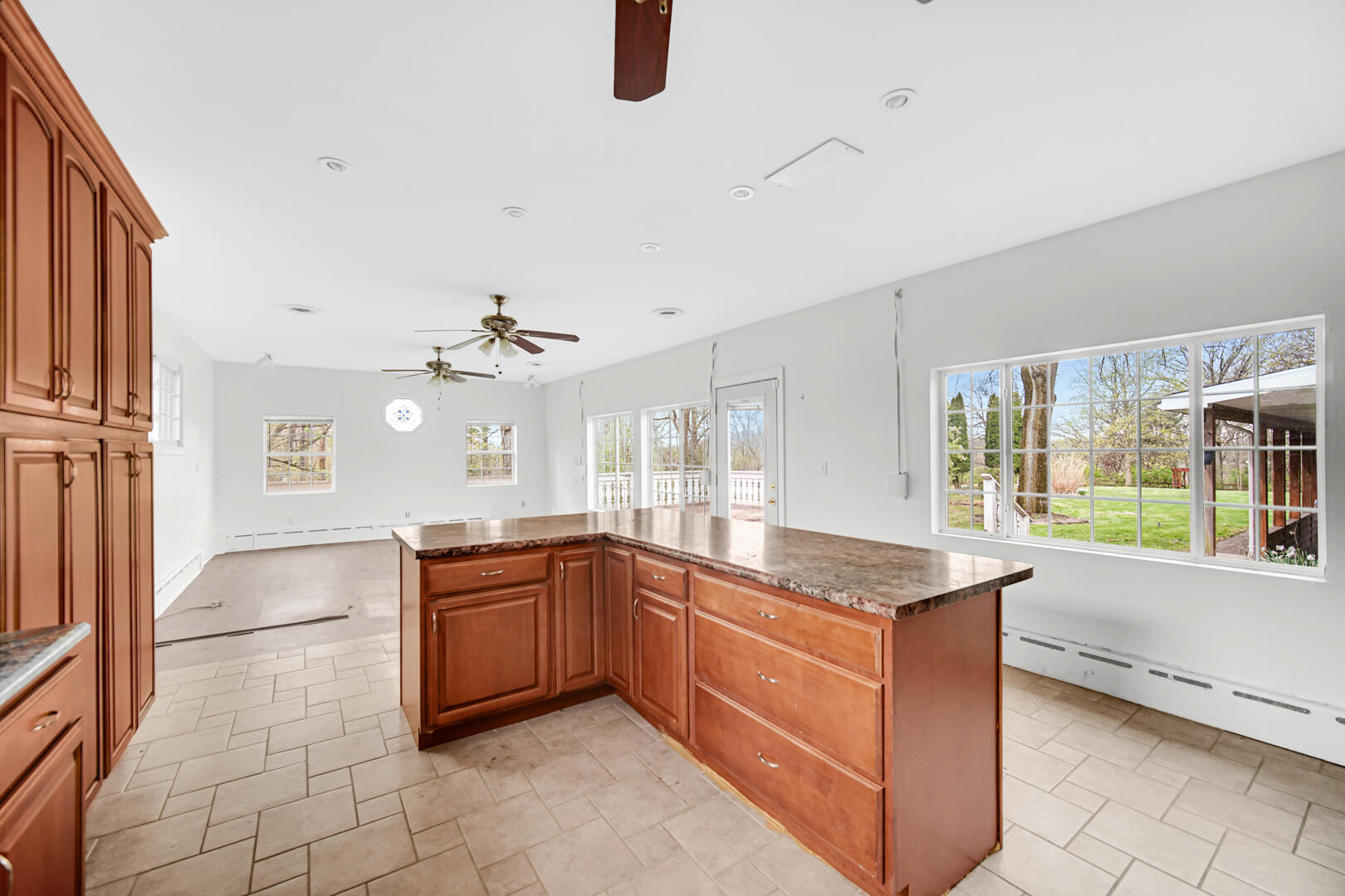 3721 West 133rd Avenue Crown Point, IN 46307 - Photo 15 of 30 a kitchen with granite countertop a sink and a stove top oven