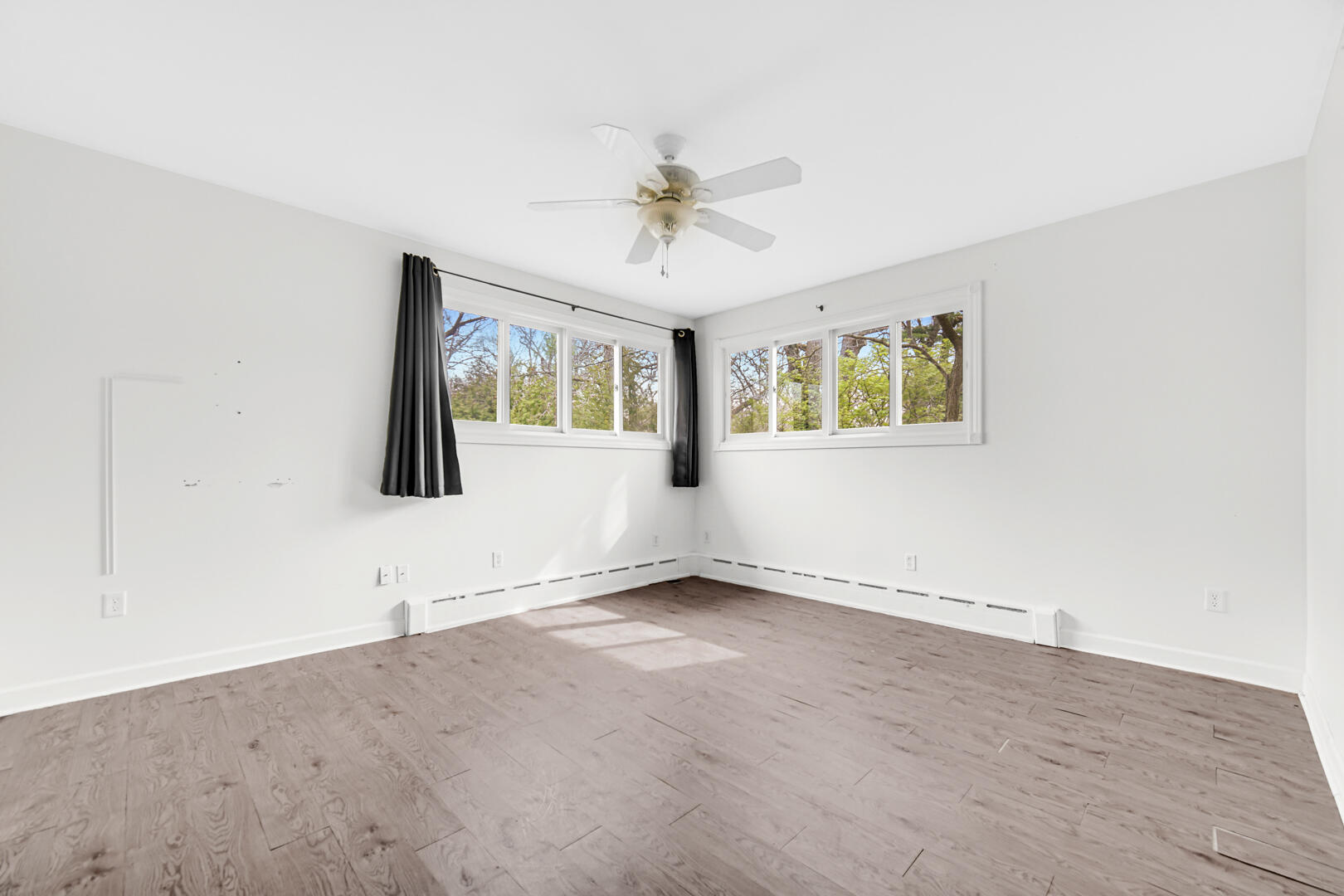 3721 West 133rd Avenue Crown Point, IN 46307 - Photo 5 of 30 an empty room with windows and ceiling fan