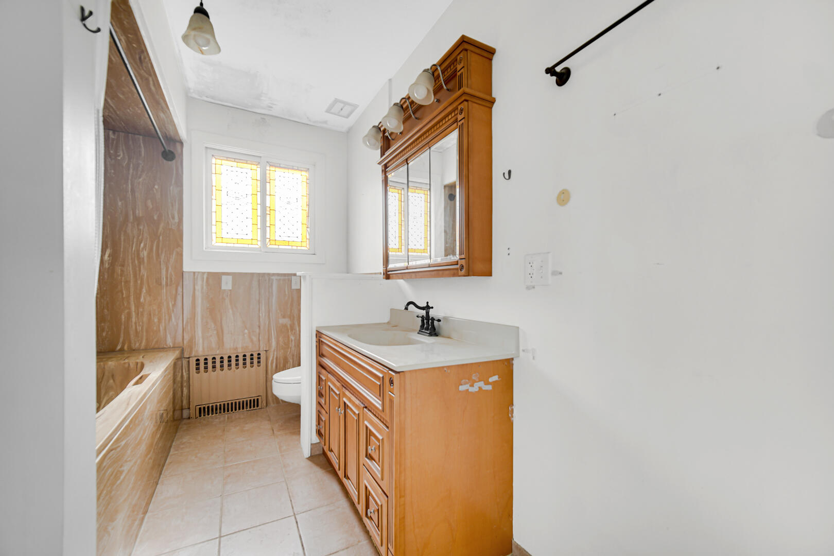 3721 West 133rd Avenue Crown Point, IN 46307 - Photo 7 of 30 a bathroom with a sink a toilet and a bathtub