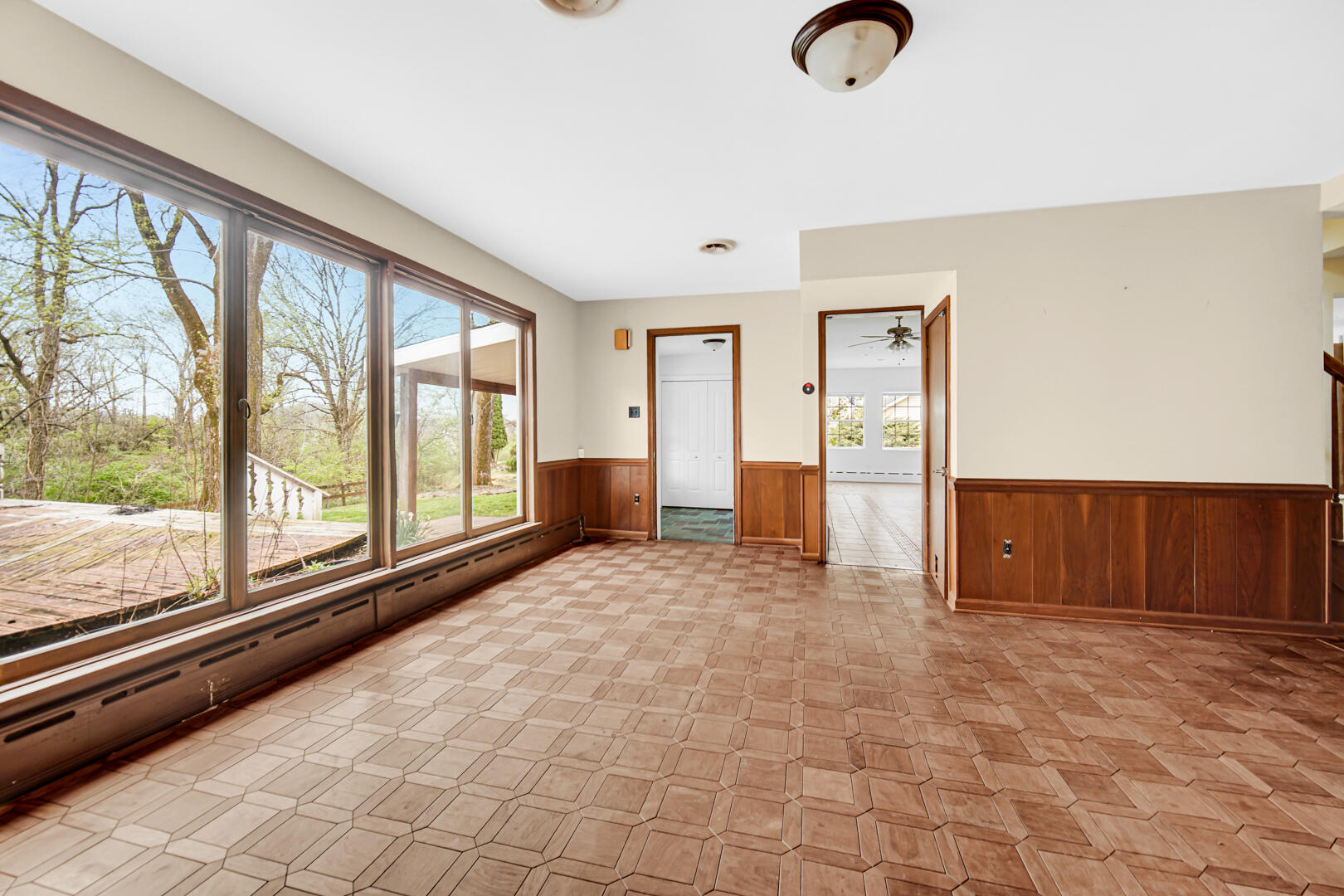3721 West 133rd Avenue Crown Point, IN 46307 - Photo 9 of 30 a view of empty room with wooden floor and fan