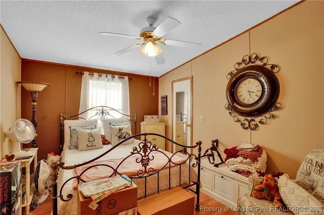 a bedroom with furniture and a mirror