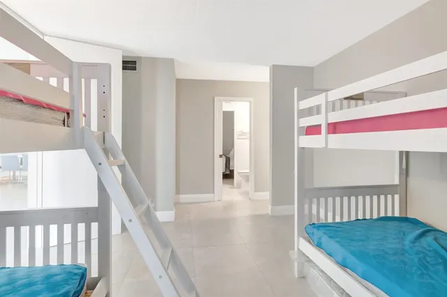 a bathroom with a tub and a shower